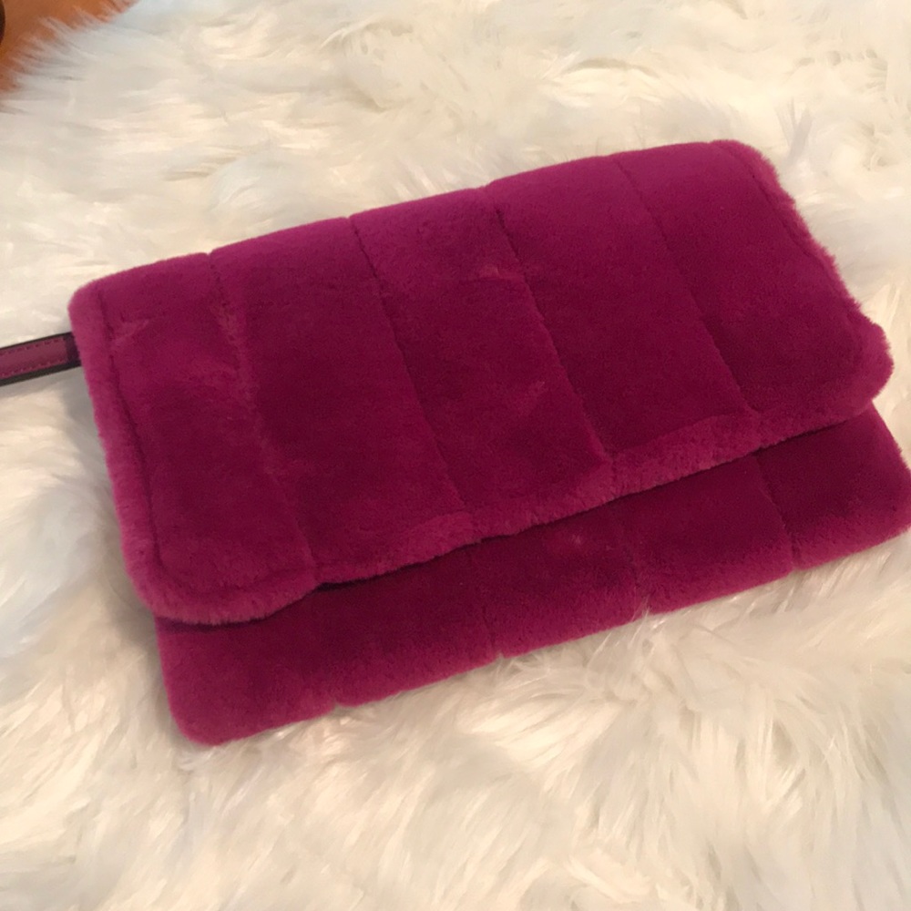 A New Day fuzzy fuchsia clutch wristlet